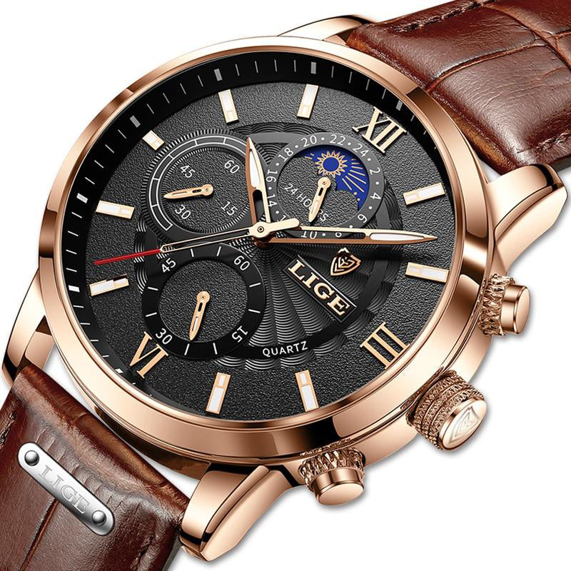 Close-up of Aurelius Timepiece men's watch featuring a gold case, black dial, brown leather strap, and moon phase complication.
