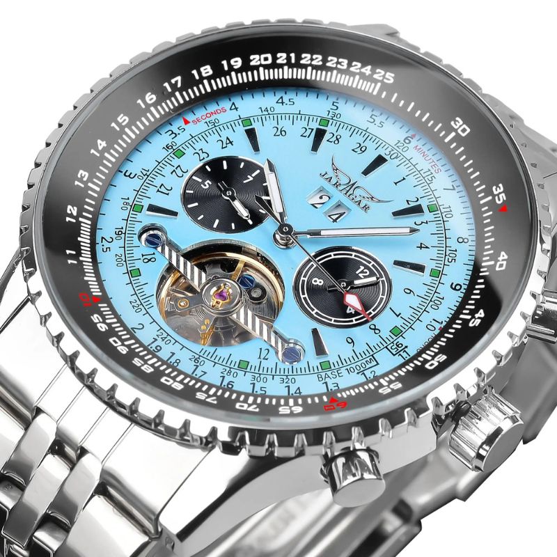 Close-up view of the Celestial Elegance automatic men's watch, showcasing its intricate blue chronograph dial, moon phase complication, and visible automatic movement with luminous hands and stainless steel case.