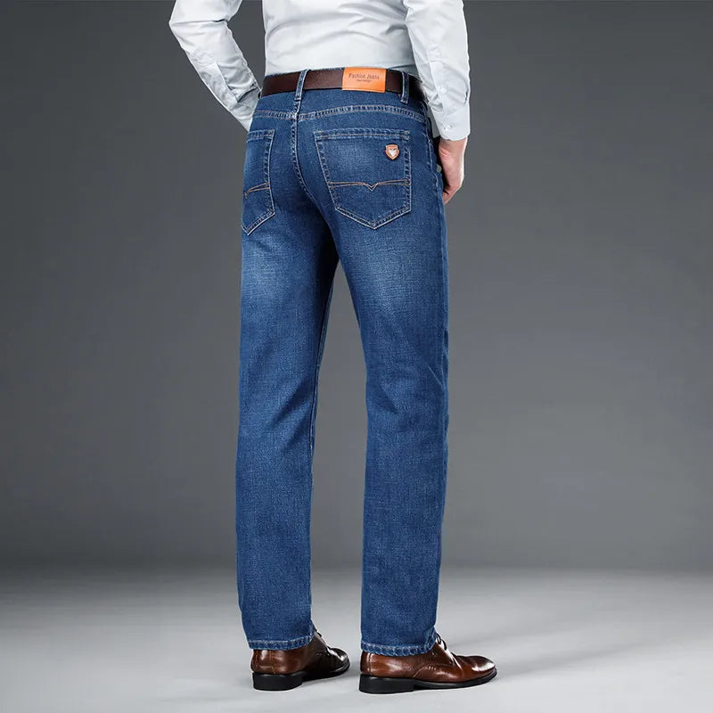 Back view of a man wearing Cityscape Trousers in light blue, showcasing the classic fit and premium cotton fabric.