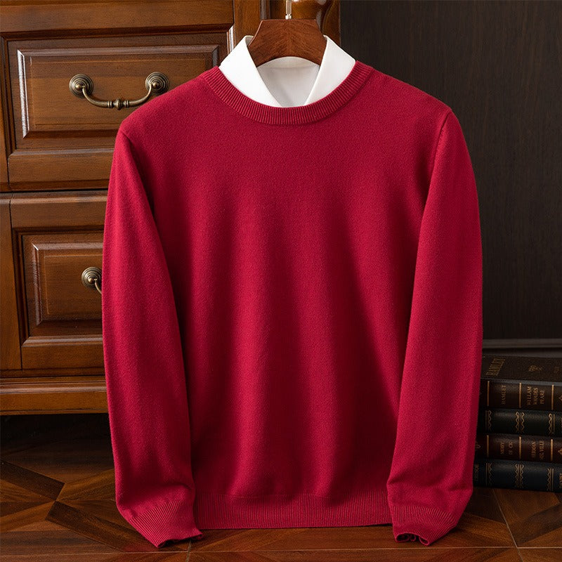 Red cashmere sweater with a white collar on a wooden hanger, highlighting its rich color and soft texture. A warm and elegant pullover for luxury fashion.