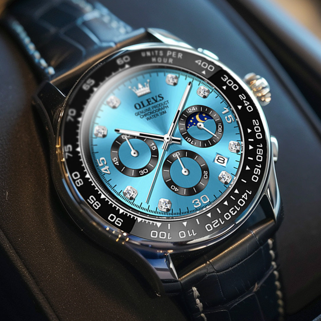 Close-up view of the Elysium Timepiece men's watch featuring a vibrant blue dial, diamond-like hour markers, three subdials, and a black crocodile-patterned leather strap.