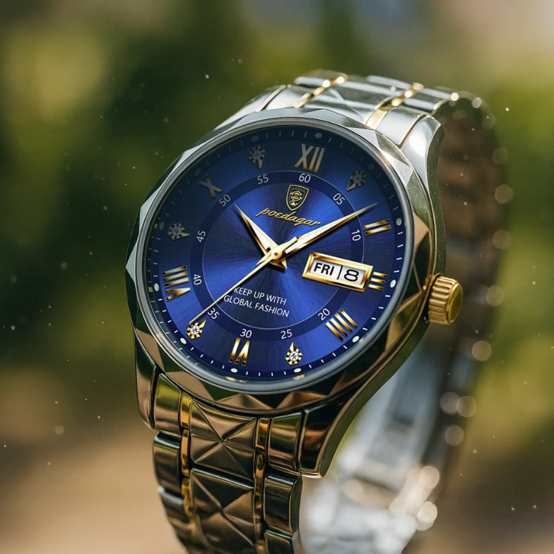 Close-up view of the Maverick Luxe men's watch, stainless steel and gold two-tone design with a vibrant blue dial, date display, and luminous hands, against a soft green background.