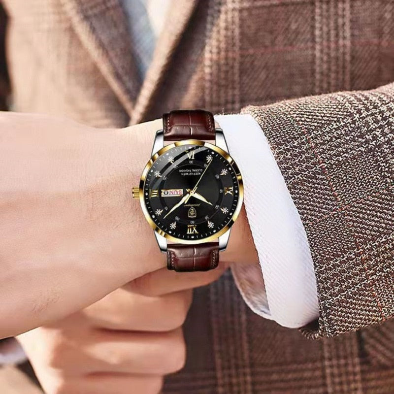 Celestial Luxe Men's Quartz Watch with gold case, black dial, and brown leather band worn on a man's wrist, complementing a brown suit jacket.