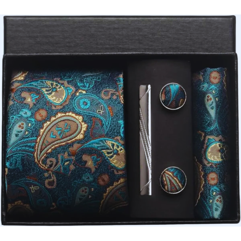 Paisley patterned tie, cufflinks, and pocket square set in a black box.