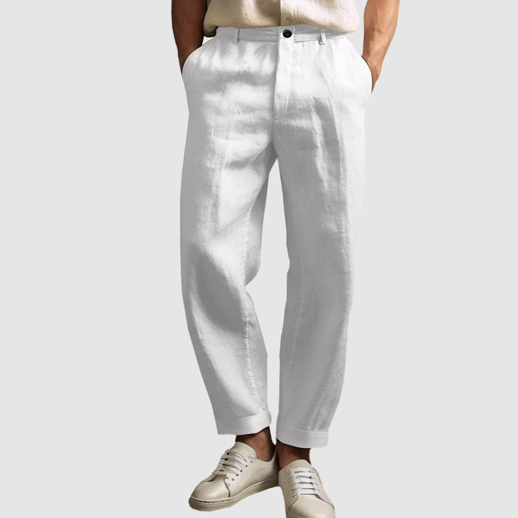 Savannah Breeze white linen straight cut pants with tailored fit, shown on a person standing with cuffed bottoms and white sneakers, ideal for summer apparel and casual wear.