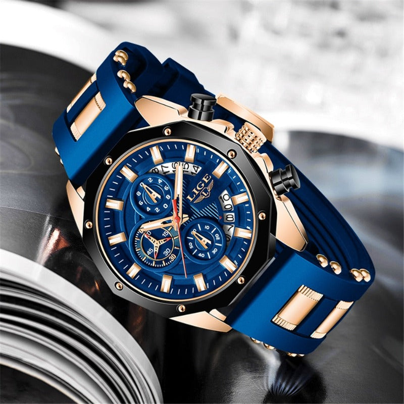 Skyline Aviator men's quartz watch with analog display and luminous hands, featuring a blue dial, gold-tone case, and blue silicone strap with gold accents, shown in an angled close-up view.