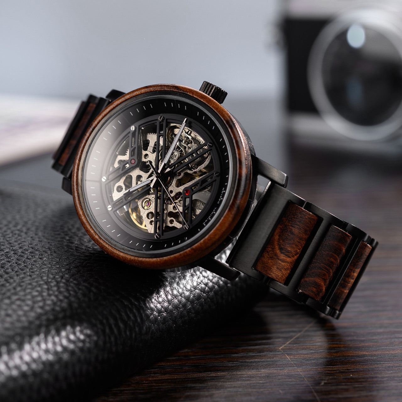 Terra Brown men's wooden watch natural finish, angled view showcasing skeleton dial, wooden bezel, wooden strap dark surface.
