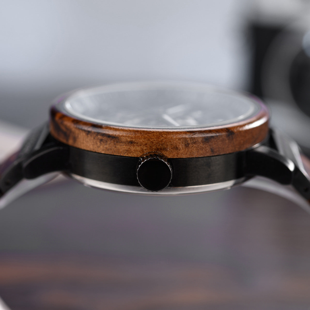 Terra Brown men's wooden watch natural finish, close-up side view showing wooden bezel, black case, crown.
