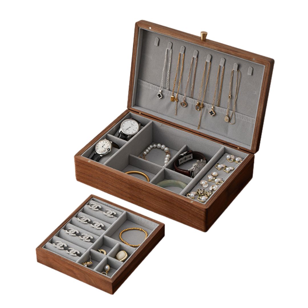 An open Timber Haven solid walnut wood jewelry box with a removable tray, showcasing various jewelry items like watches, necklaces, rings, and bracelets. The box is on a white background.