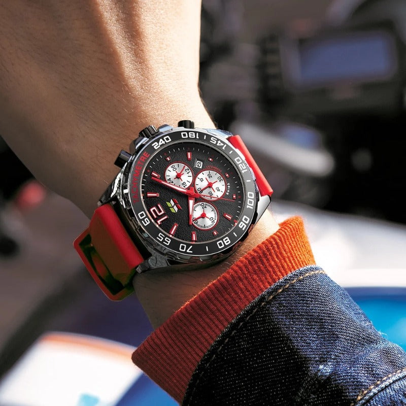 Apex Dusk men's quartz watch with luminous hands and date display, featuring a black dial with red accents and a red silicone strap, worn on a man's wrist with a denim jacket.