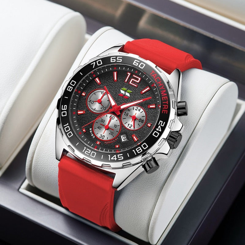 Apex Dusk men's quartz watch with luminous hands and date display, featuring a silver case, black dial with red accents, chronograph subdials, and a red silicone strap, presented on a white display stand.