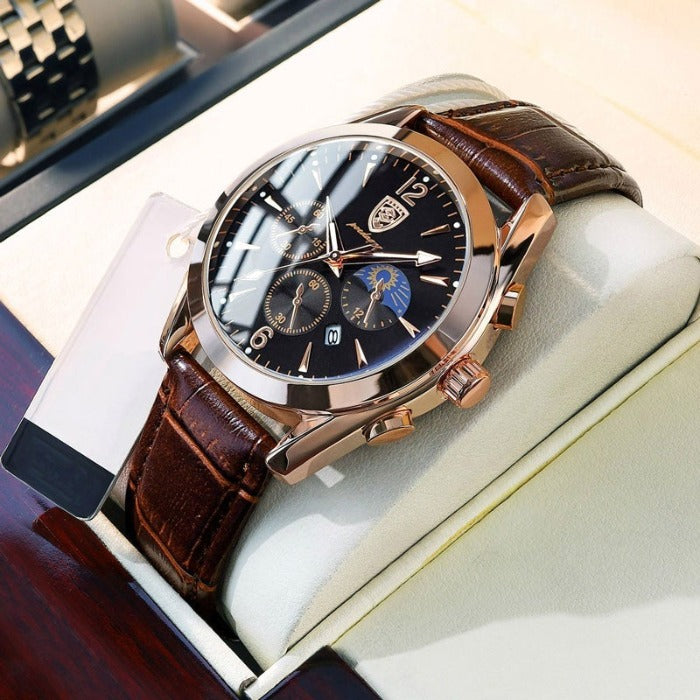 Aventadori men's watch in rose gold with a dark brown leather strap and black dial, featuring chronograph sub-dials and a moon phase indicator, displayed in a luxury white watch box. Ideal for a sophisticated look.