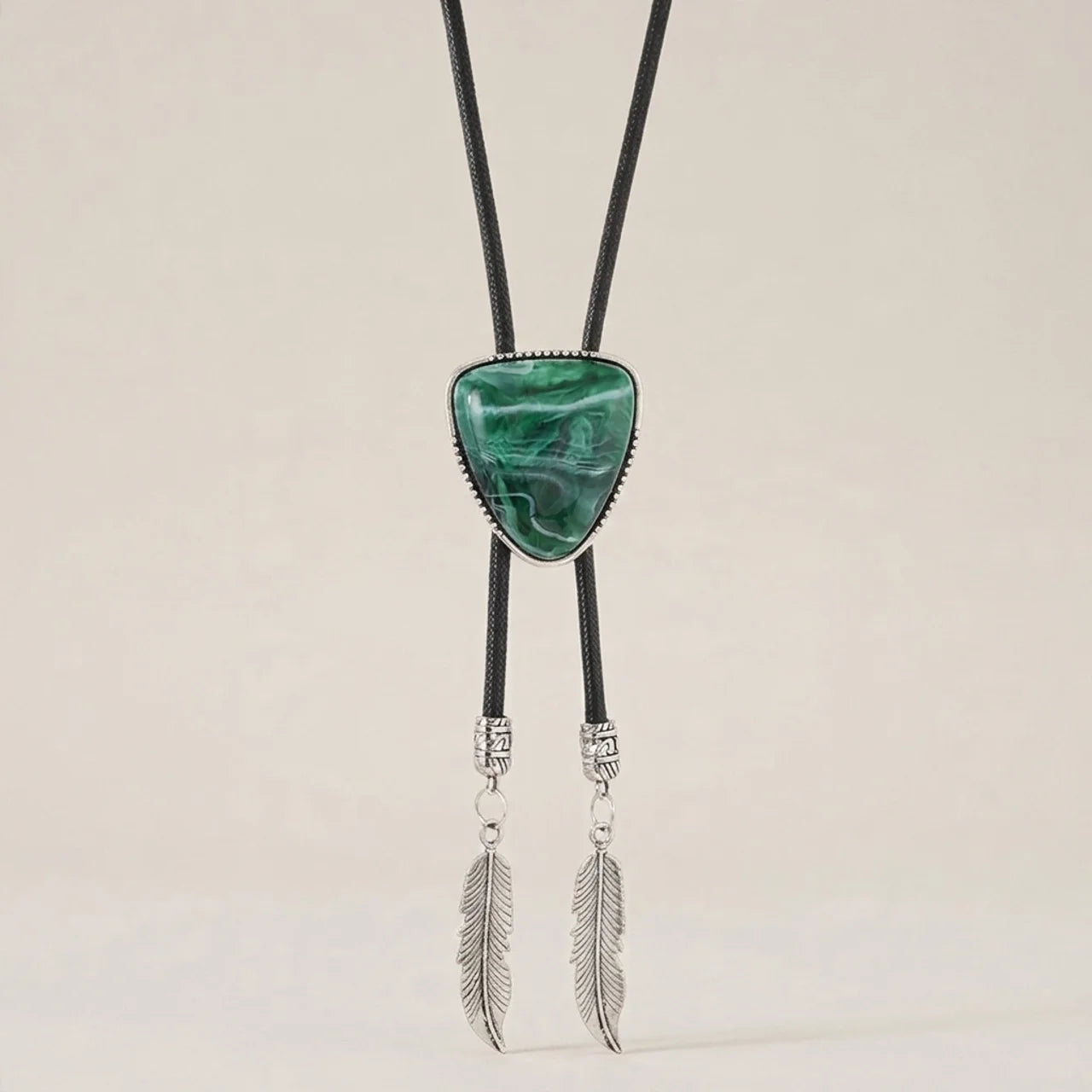 Green alloy triangle pendant necklace shown at three-quarter angle with vintage retro style