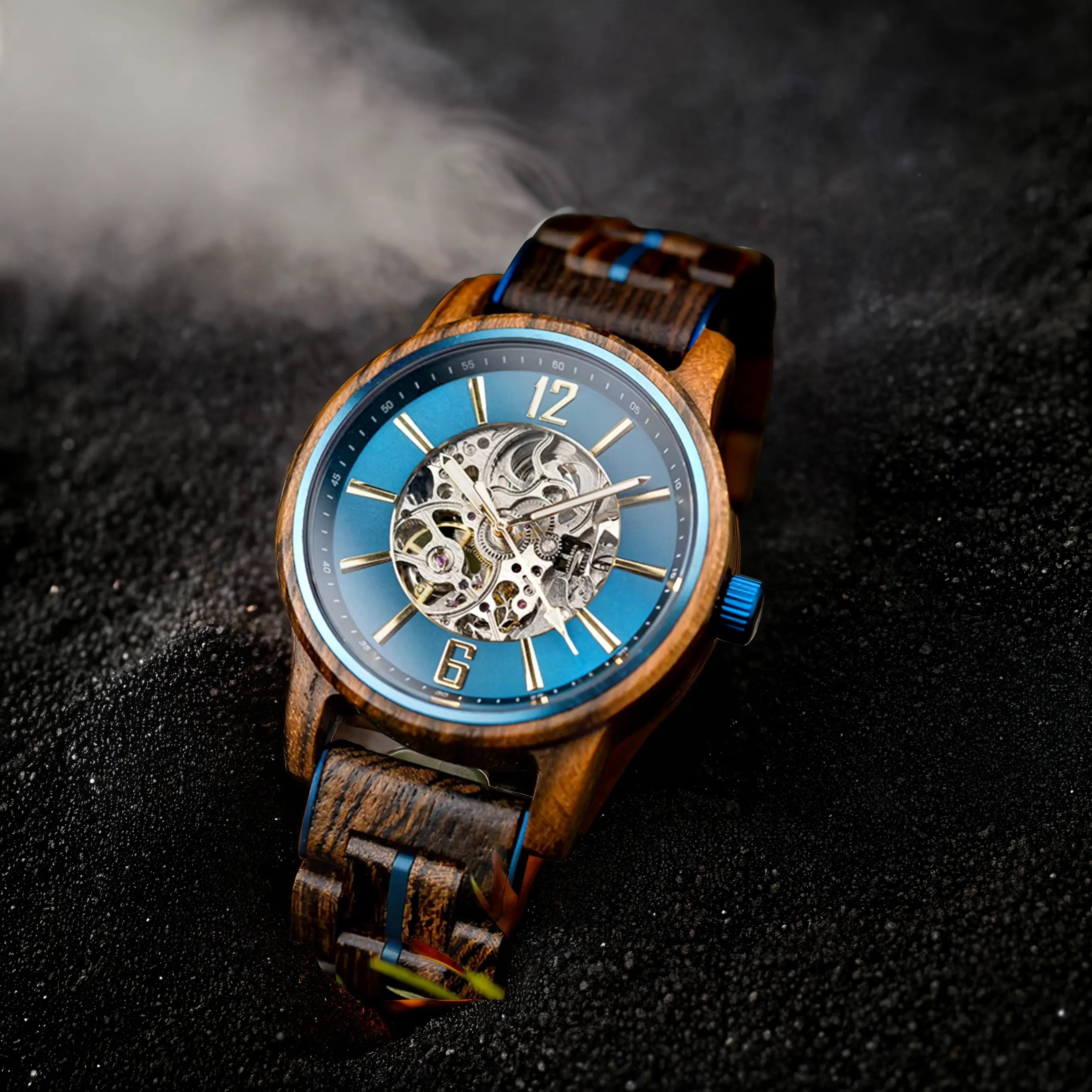 Cascadia Blue men's wooden watch with stainless steel accents, featuring a striking blue skeleton dial, visible gears, and a dark wood strap with blue details, presented on a dark, smoky background.