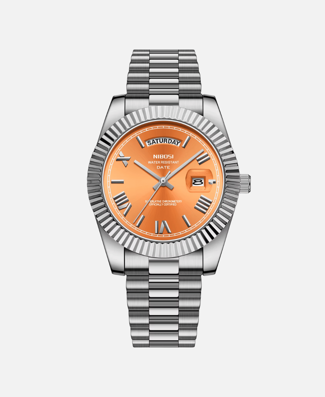 Dateday Classic Watch with a silver-tone stainless steel case, fluted bezel, and metal bracelet. The watch features a vibrant orange dial with Roman numeral hour markers, a day display showing 'SATURDAY', and a date window showing '8'.