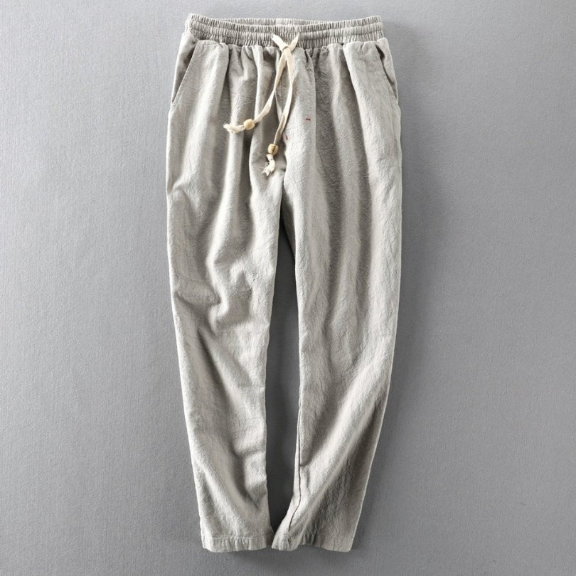 Full flat lay view of the Edo Escape Japan-style linen trouser in light gray, featuring a relaxed fit, elastic waistband, and adjustable drawstring. Highlights the lightweight and comfortable design.