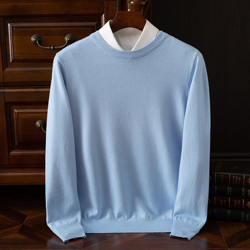 Sky blue cashmere sweater with a white collar on a wooden hanger, showcasing its luxurious softness and elegant knit. Ideal for fall fashion and comfortable wear.