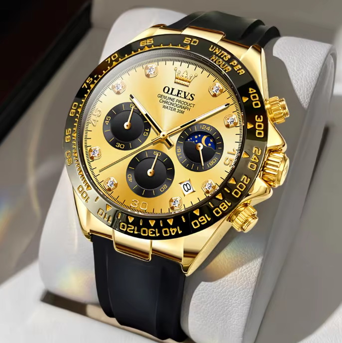 Elysium Timepiece men's gold watch with black silicone strap, gold dial, diamond hour markers, chronograph subdials, moon phase, and date display. Features quartz movement, luminous hands, and water resistance for a modern, casual style.