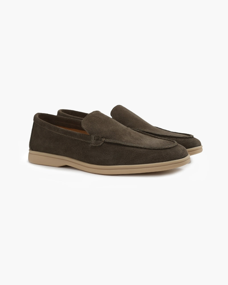 Heritage Luxe men's olive green suede loafers with classic stitching, shown as a pair from an angle on a white background. High-quality materials and comfortable.