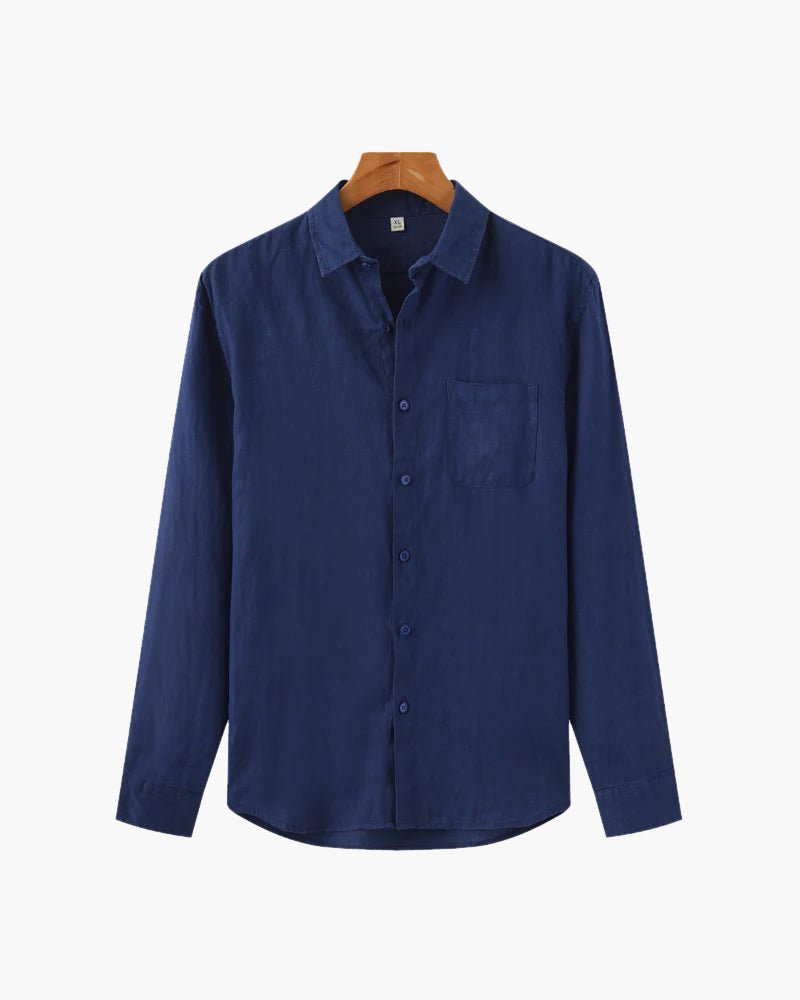 A navy blue Linen Essence men's shirt, made from 100% linen, displayed flat on a white background on a wooden hanger. The image shows the full front view of the classic fit shirt.