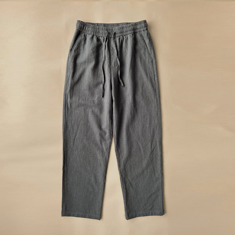 Luxe Retreat Comfy Linen Pants with Relaxed Fit in gray, laid flat on a neutral background, showing the elastic waistband, drawstring, and side pockets. Ideal for casual wear and summer fashion.