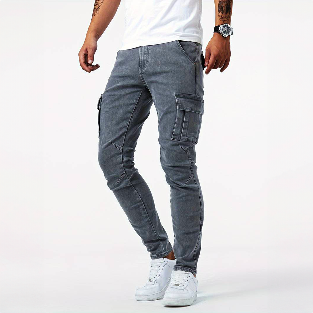 Men's Metro Blue Cargo Trousers in gray, shown on a model from a side view, featuring multiple cargo pockets, an adjustable waistband, and a comfortable fit. The model wears a white t-shirt and white sneakers.