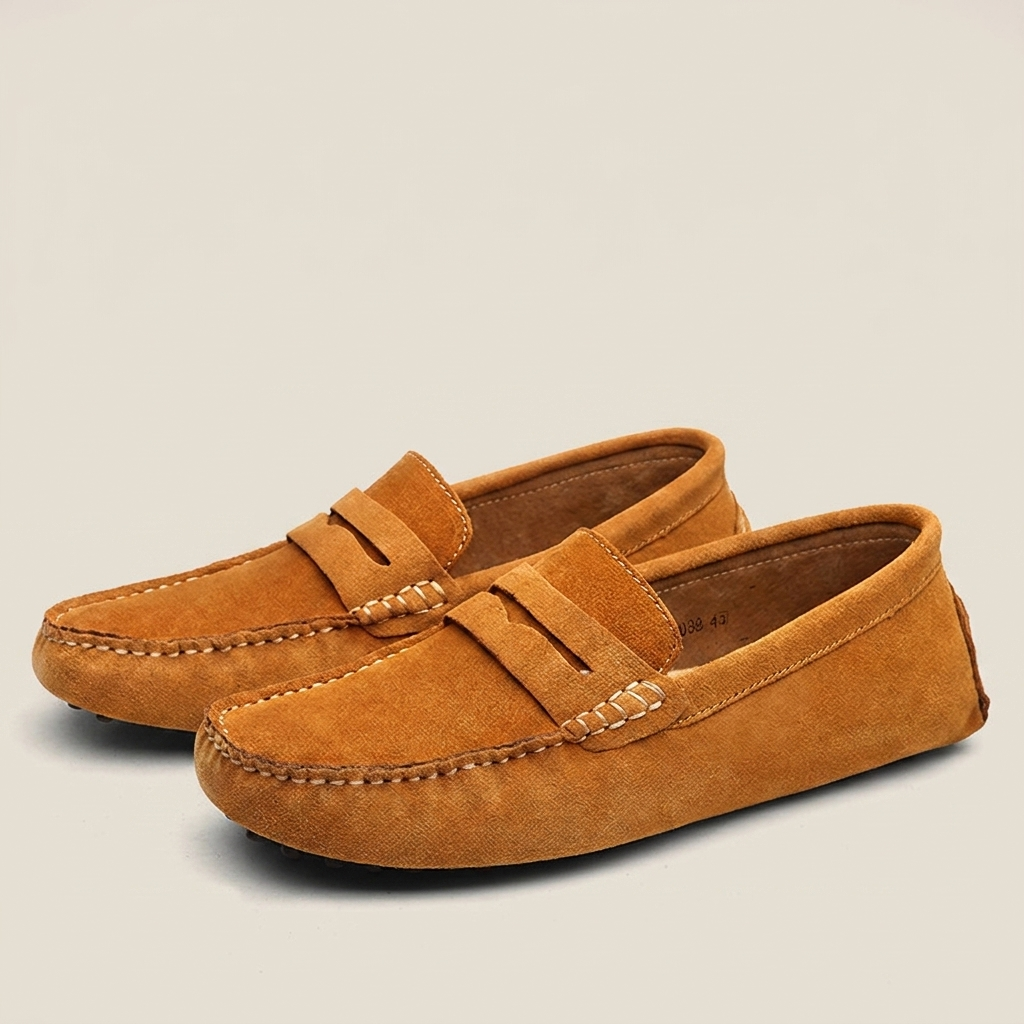 Brown nubuck leather breathable slip-on loafer at three-quarter angle highlighting breathable upper, slip-on style and flat heel