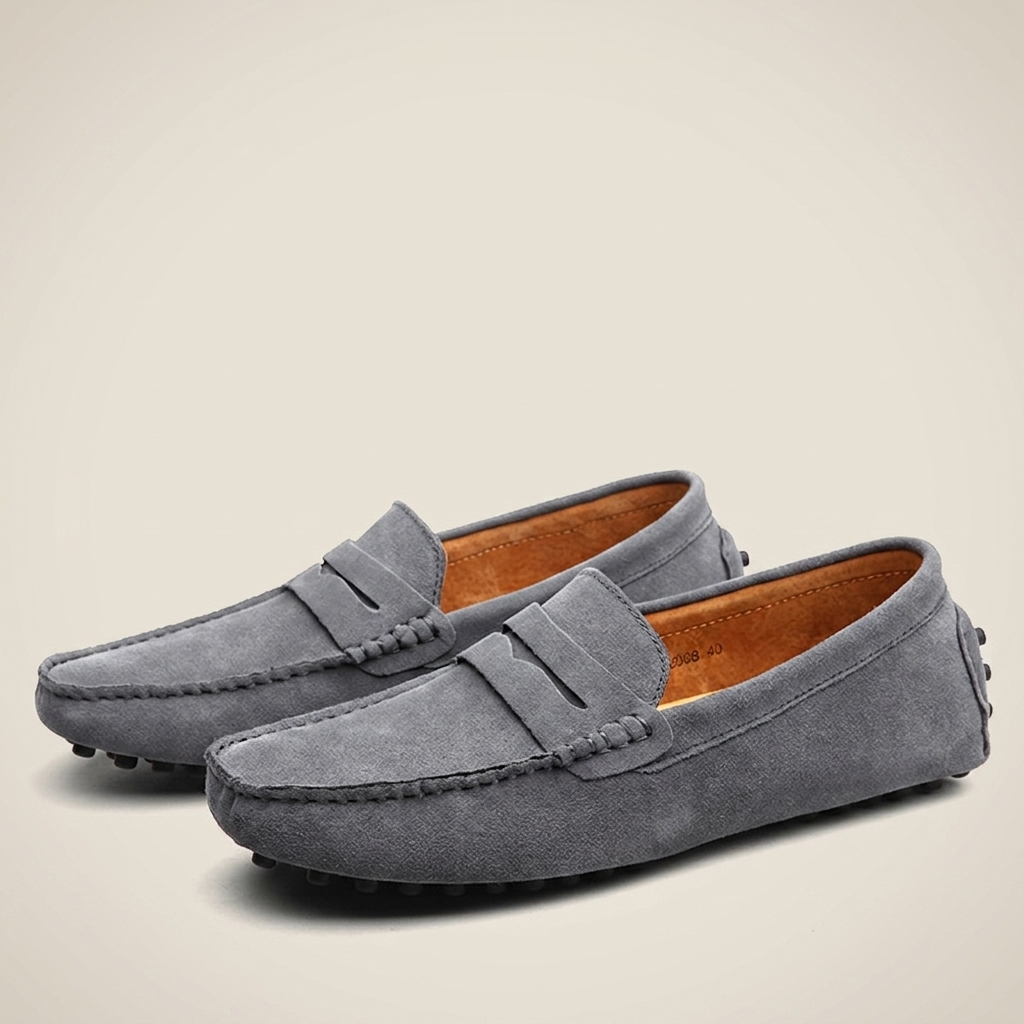 Gray nubuck leather breathable slip-on loafer top-down close-up showing detailed stitching, round toe and flat heel