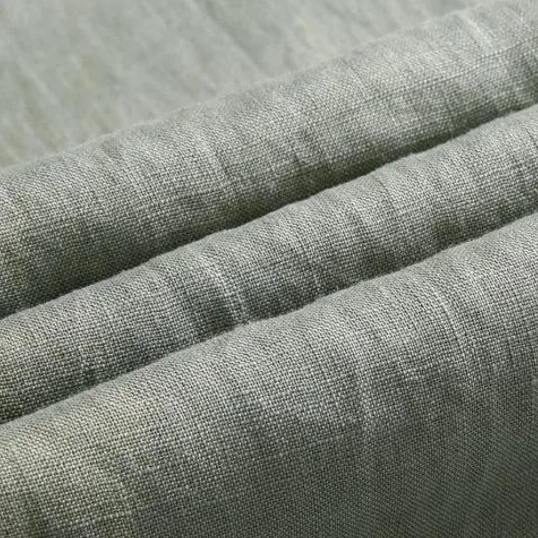 Close-up of Sahara Whisper green linen pants fabric, showing the soft touch finish and breathable texture.