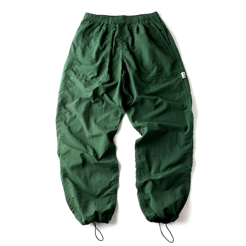 Front view of Sakura Breeze men's waterproof breathable casual pants in green, featuring a relaxed fit and adjustable drawstring cuffs.