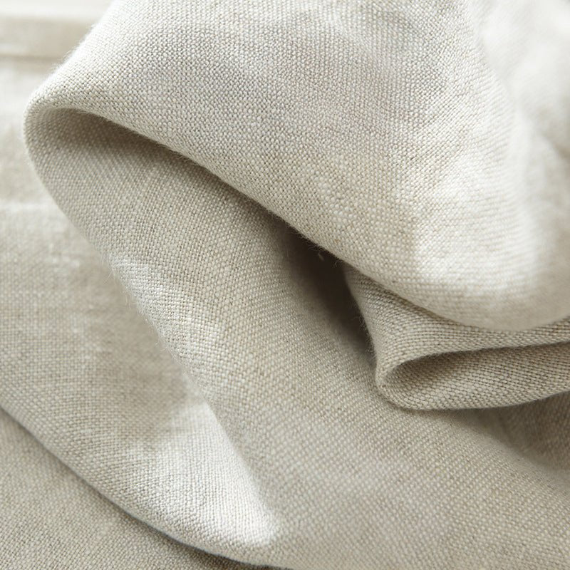 Extreme close-up Savanna Breeze lightweave beige linen fabric, showcasing natural texture, breathable weave, quality material tailored fit pants.