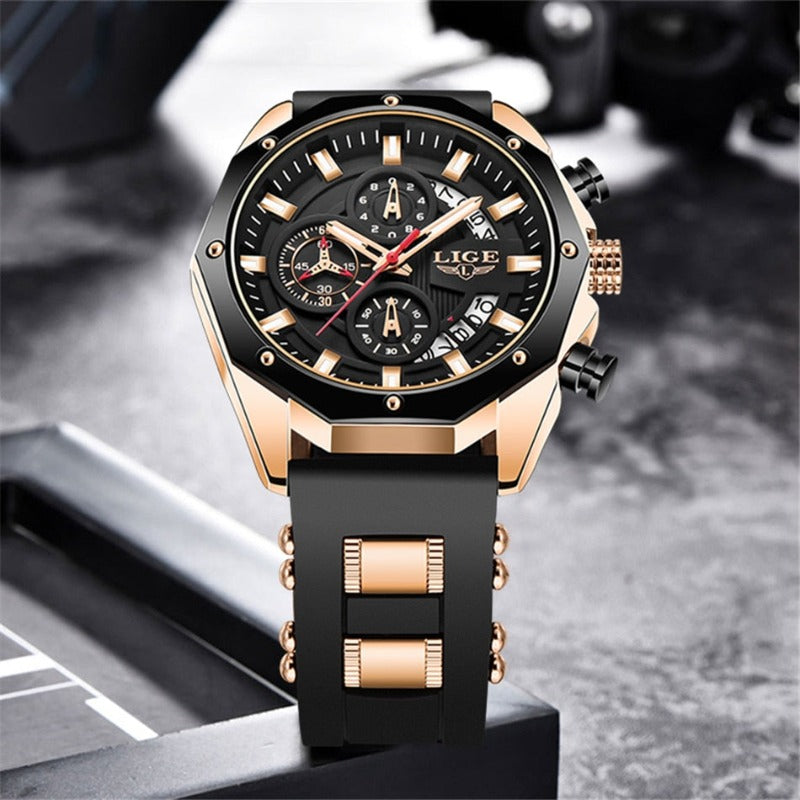 Skyline Aviator men's quartz watch with analog display and luminous hands, featuring a black dial, gold-tone case, and black silicone strap with gold accents, displayed on a dark textured background.
