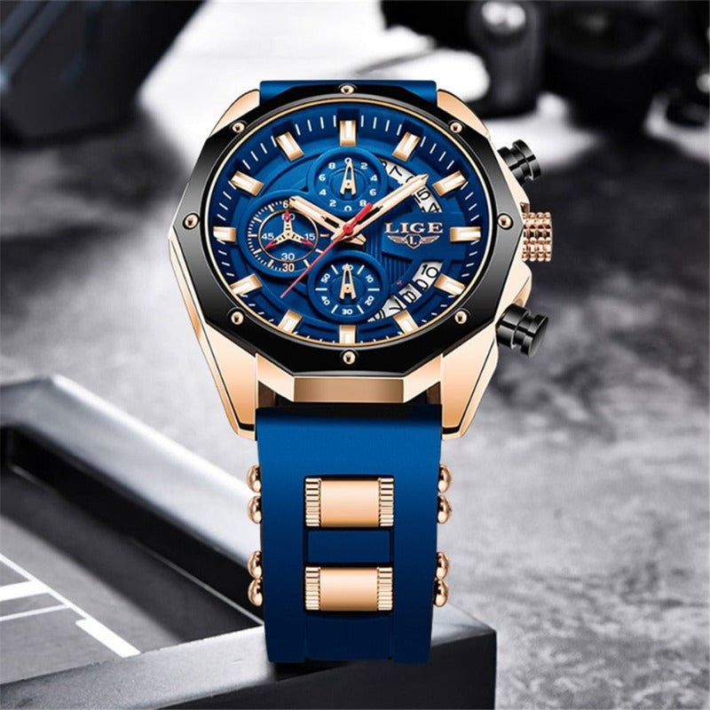 Skyline Aviator men's quartz watch with analog display and luminous hands, featuring a blue dial, gold-tone case, and blue silicone strap, standing upright on a dark surface.