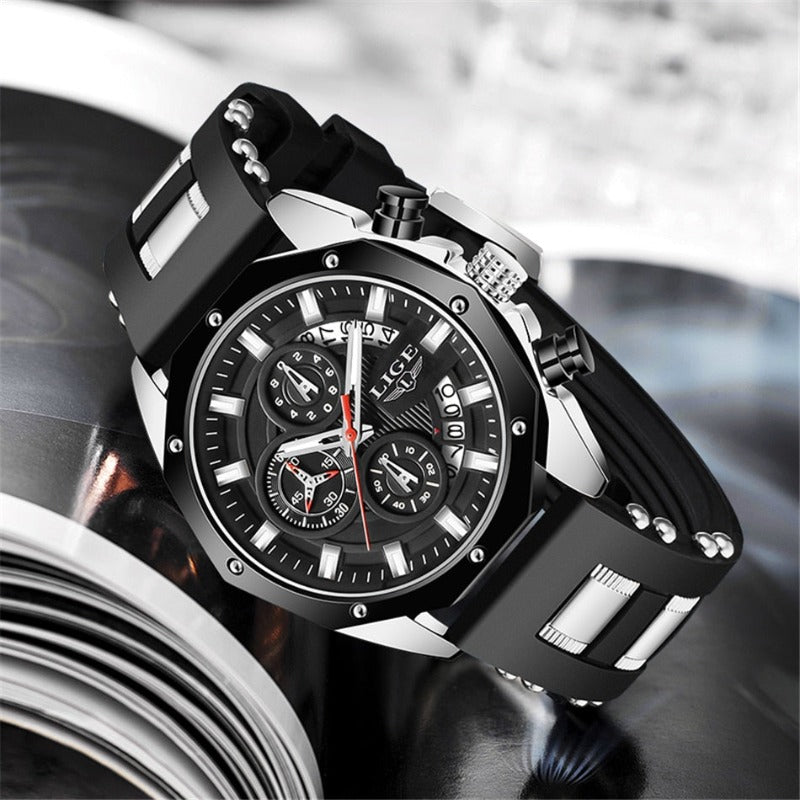 Skyline Aviator men's quartz watch with analog display, black dial, silver case, black silicone strap with silver accents, luminous hands, chronograph, and date display.