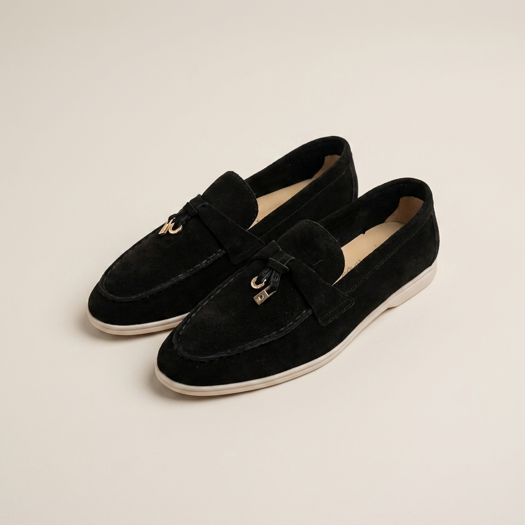 Black matte sheepskin suede loafer front view showing low heel and round toe slip-on design