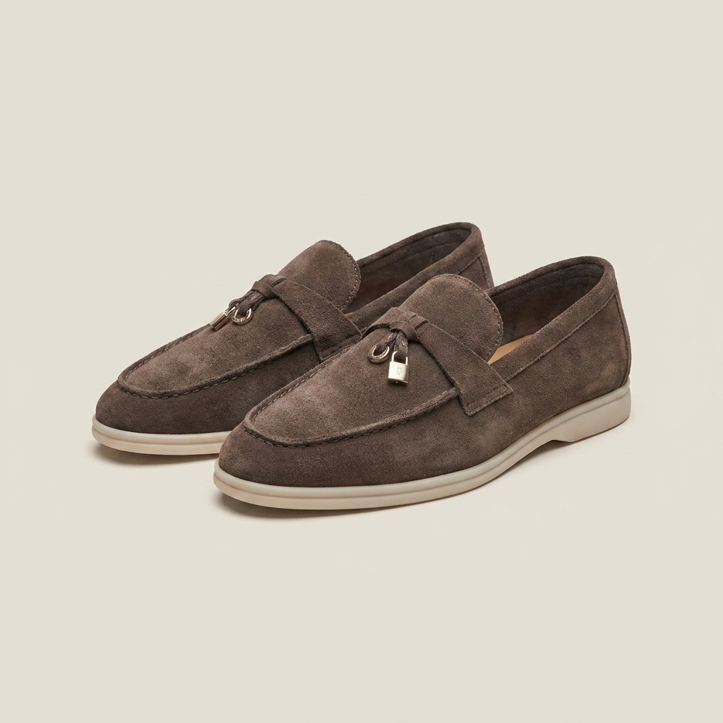 Burgundy matte sheepskin suede loafer at three-quarter angle showing low heel and round toe