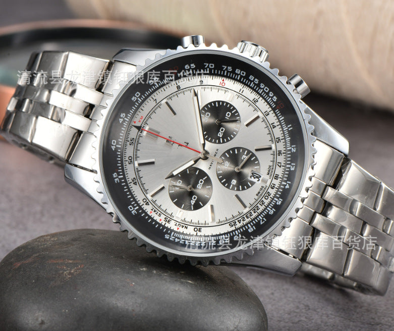 Top down view of tan leather strap watch dial showing three subdials and calendar on quartz chronograph