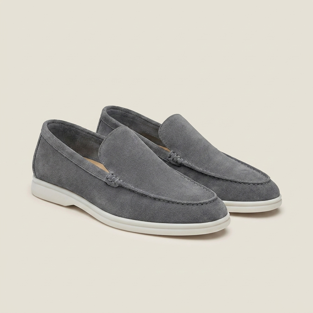 Charcoal suede round toe slip-on loafer shoe shown front view with stitching detail and low heel