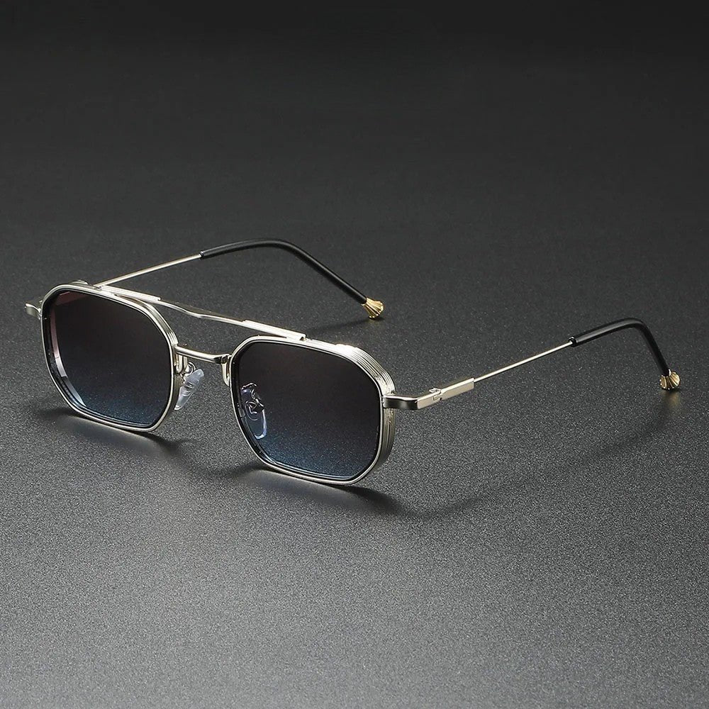 Titanium Horizon Aviator Sunglasses with silver polished metal frames and blue gradient lenses, shown at an angle on a dark surface.