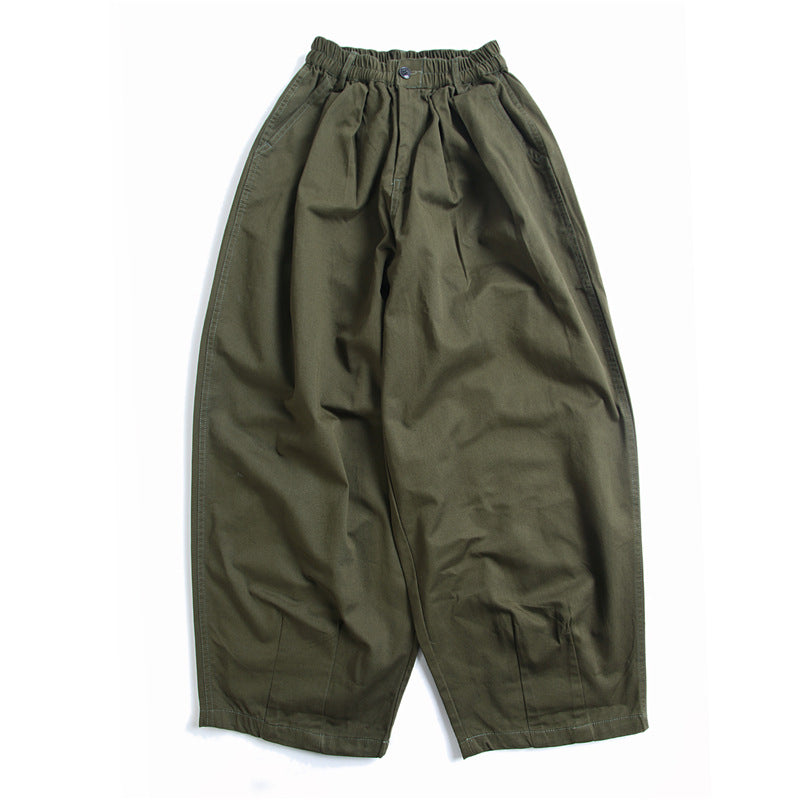 Urban Luxe men's wide-leg casual pants in green, laid flat showing the front view with an elastic waistband and button closure. Soft fabric, relaxed fit.
