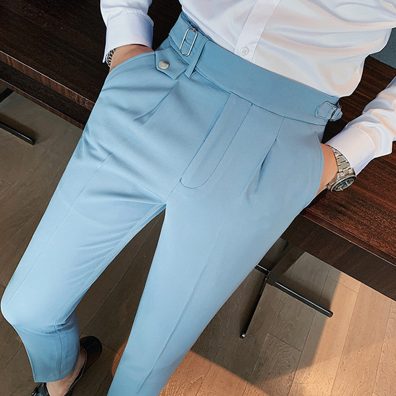 Close-up view of Men's Vintage Charm retro suit pants in sky blue, highlighting the lightweight fabric, tailored fit, pleats, and adjustable side buckle detail. Worn with a white shirt.