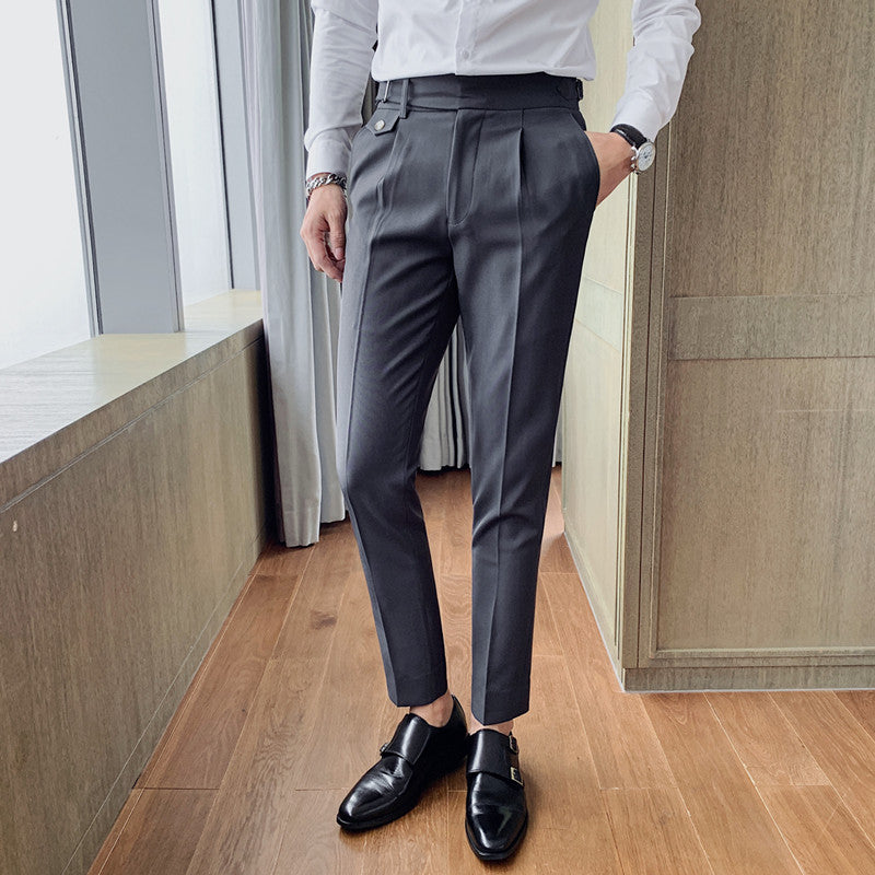 Men's Vintage Charm retro suit pants in dark grey, featuring a lightweight fabric and tailored fit. Model wears pleated pants with a white shirt and black loafers, showcasing the side buckle detail. Ideal for business casual or formal wear.