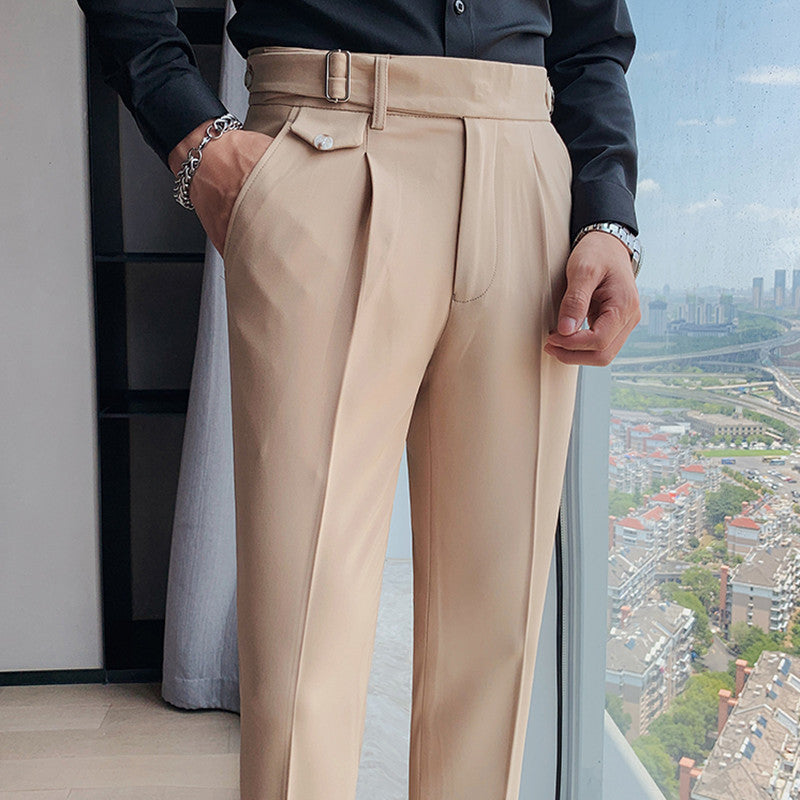 Men's Vintage Charm retro suit pants in lightweight khaki fabric, tailored fit with pleats and unique waistband buckle detail, worn by a man in a black shirt. Ideal for business casual or formal wear.
