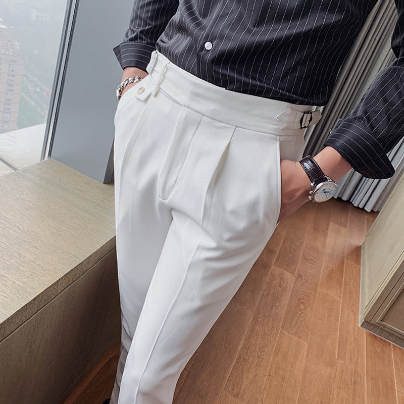 Men's Vintage Charm retro suit pants in lightweight white fabric, tailored fit with pleats and unique waistband buckle detail, worn by a man in a striped black shirt. Stylish and comfortable.