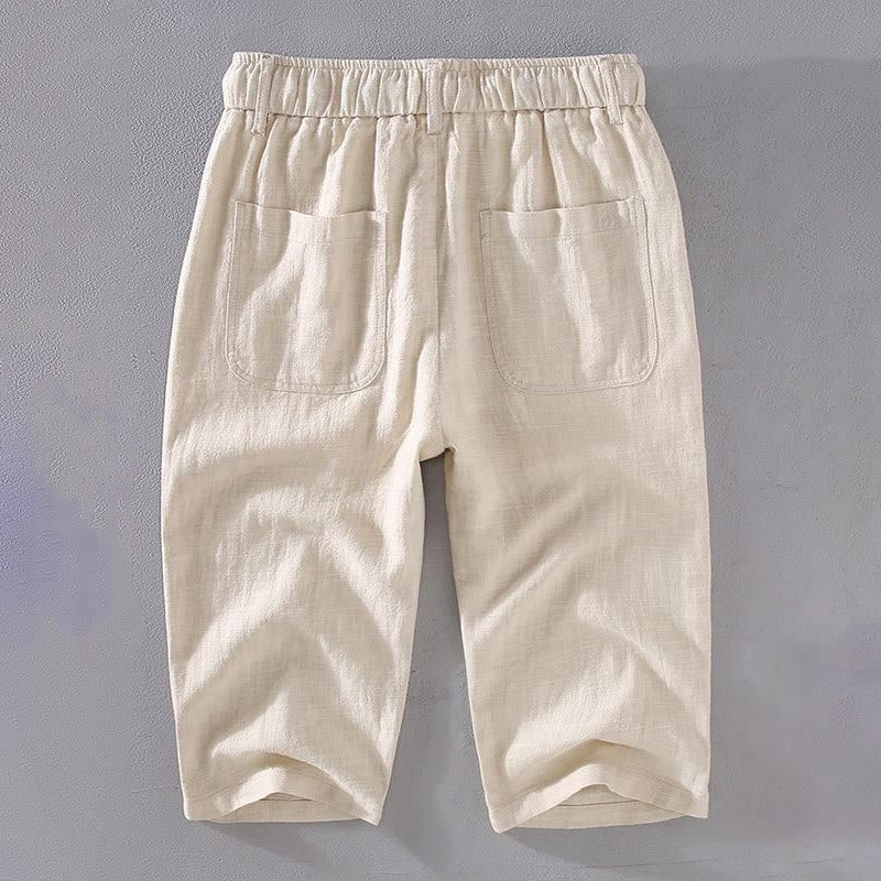 Back view of Zenith Grove men's linen cropped pants in a light beige color, featuring an elastic waistband and two functional back pockets.