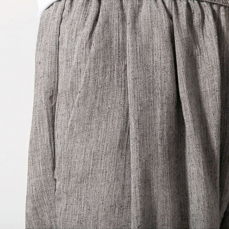 Close-up of Zenith Stones gray linen men's pants, highlighting the comfortable drawstring waistband and fabric texture.